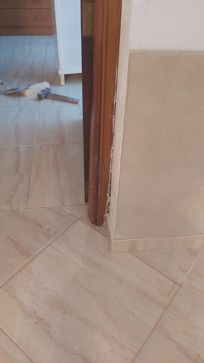 Fully reinstated tiled floor after repair — clean and seamless